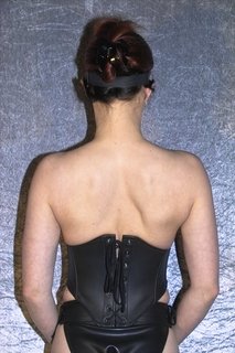 Corset equipped with zipper and lacing